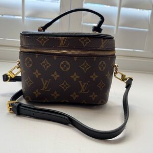 Excellent condition LUXE Nice Nano – Monogram Canvas with Black Leather Trim